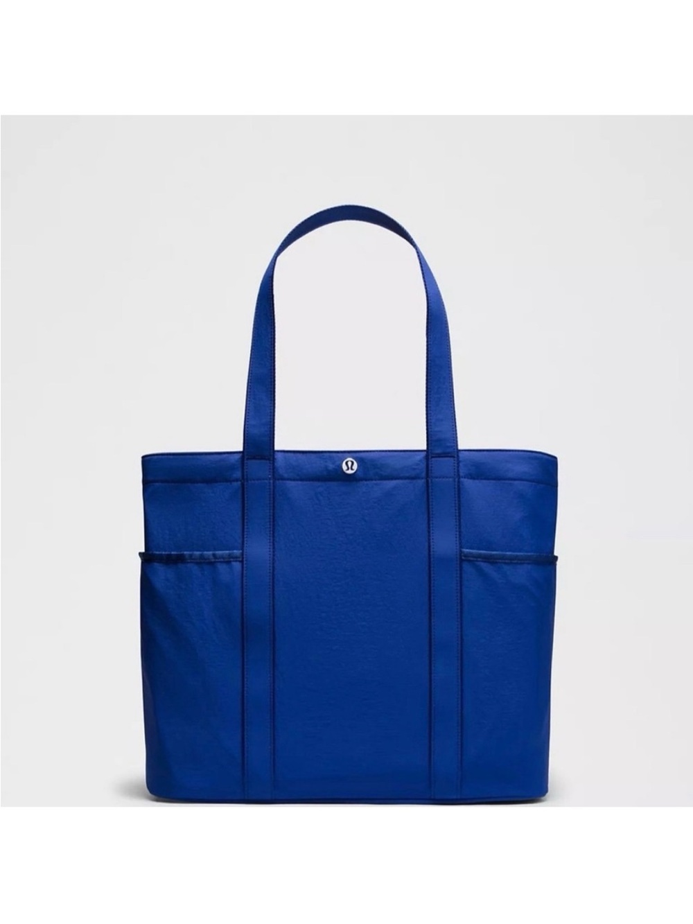 lululemon cobalt blue tote with exterior slip pockets